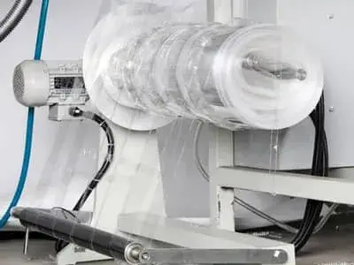 Waste material rewinder 